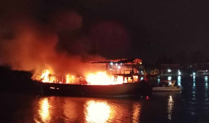 Boat catches fire at river pier