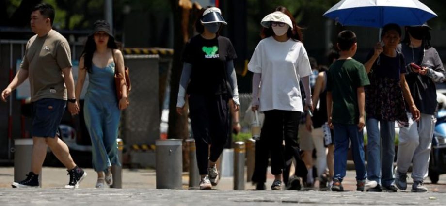 Chinese cities break heat records, stressing electricity grid