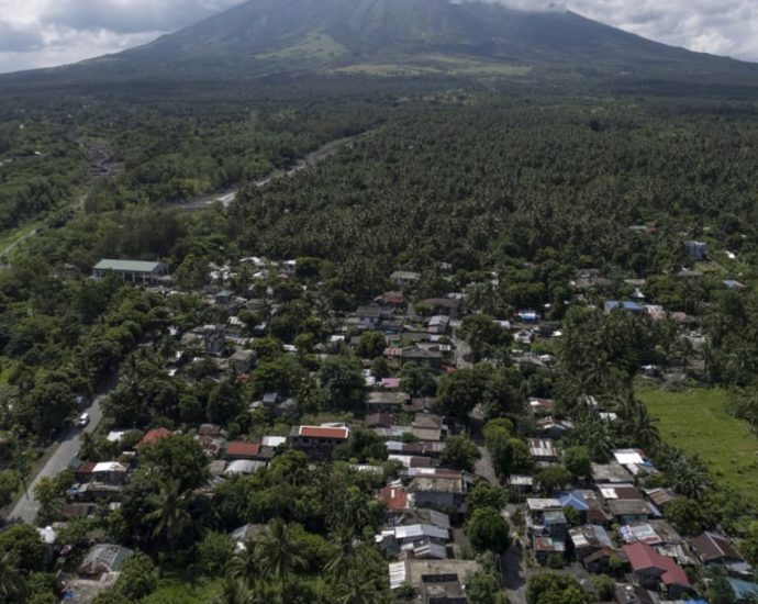 Poor villagers risk their lives in danger zone as Philippines’ most active volcano erupts