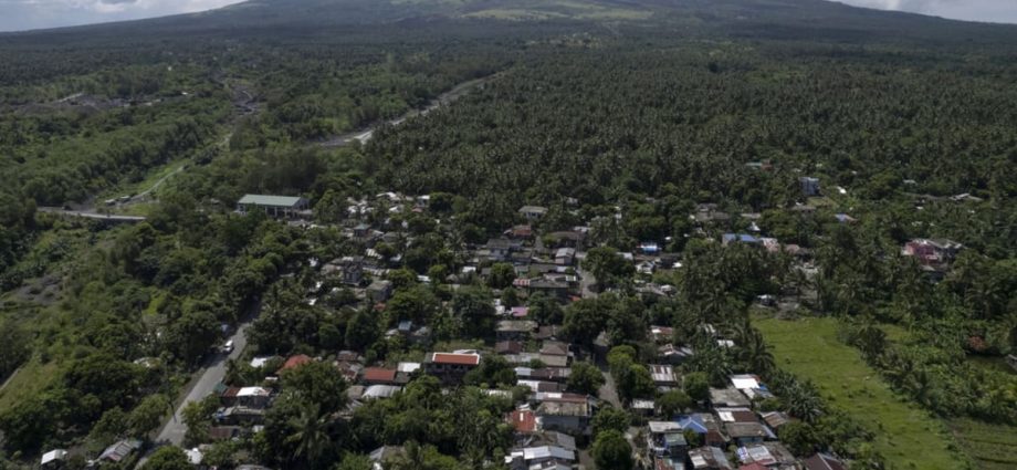 Poor villagers risk their lives in danger zone as Philippines’ most active volcano erupts