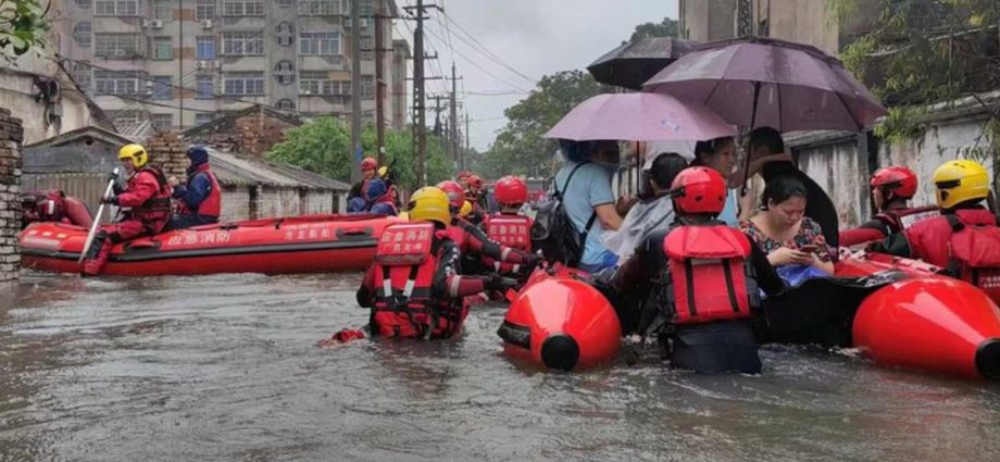 China evacuates 40,000 people from floods, more rain expected