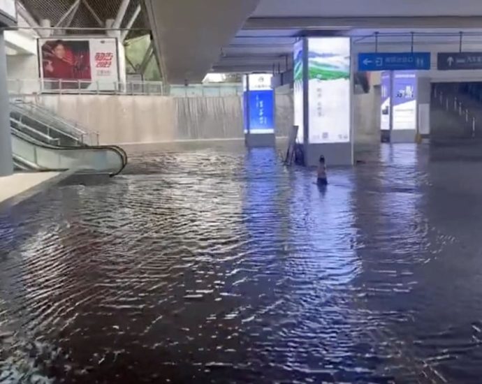 Chinese cities brace for floods as heat scorches inland regions