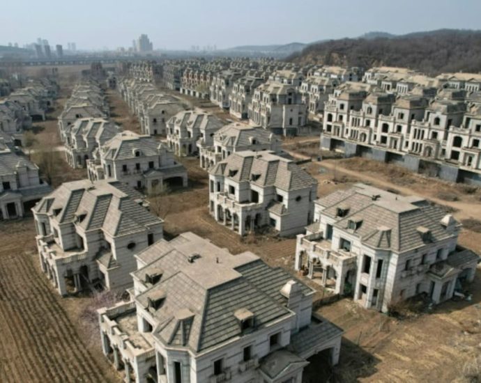 Chinese ghost town of mansions reclaimed by farmers