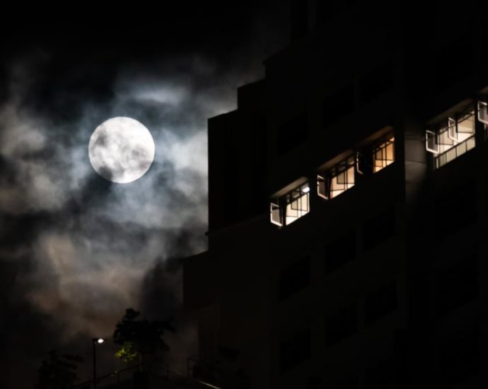 Cloudy with a chance of moon: Singapore photographers capture supermoon despite bad weather