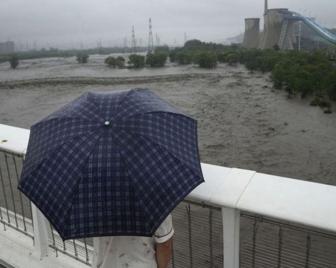 Extreme rain in Beijing after Typhoon Doksuri turns roads into rivers, kills two