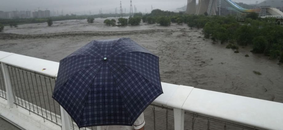 Extreme rain in Beijing after Typhoon Doksuri turns roads into rivers, kills two