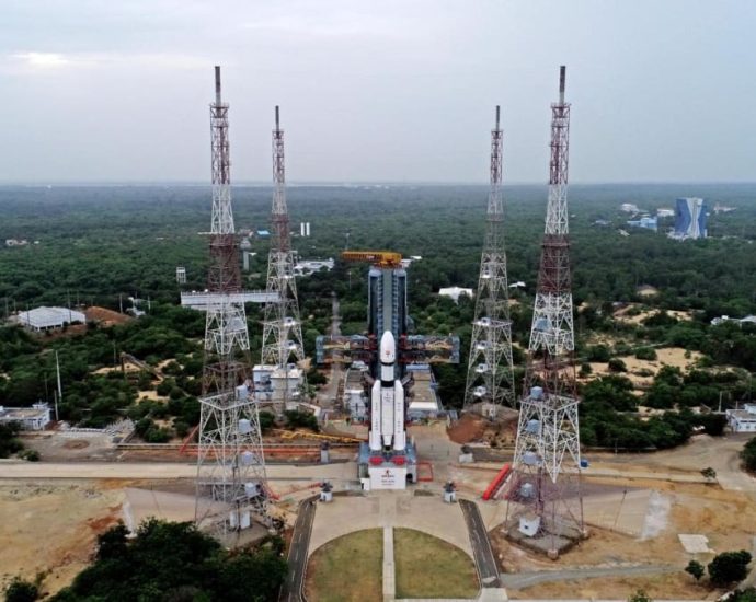 India launches rocket to land spacecraft on moon