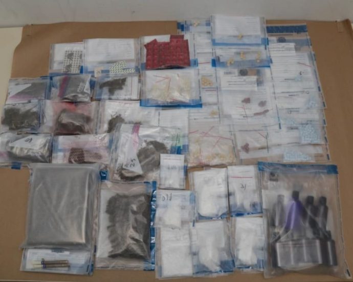 Man charged after drugs worth S3,000 seized by CNB; police officer injured during arrest