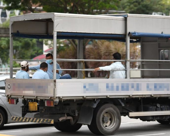 Migrant worker rights groups in Singapore call for timeline to ban transporting workers in lorries