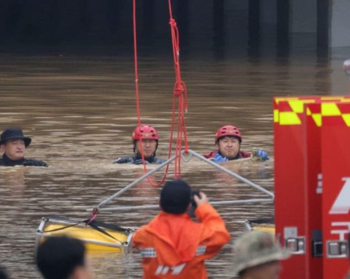 Rescuers retrieve eight bodies from flooded South Korea underpass