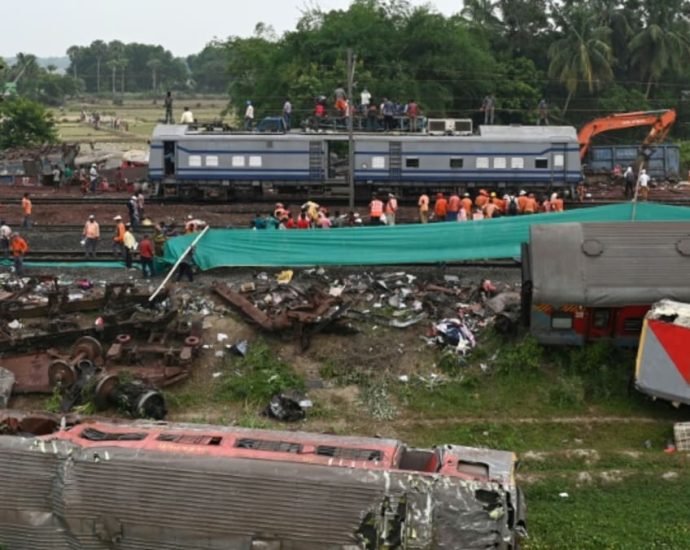 Three railway workers arrested over India’s deadly train crash