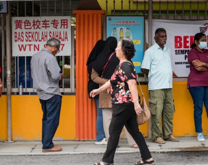 Hopes, frustration, and resolve on display as voting kicks off to a slow start in Malaysian state polls