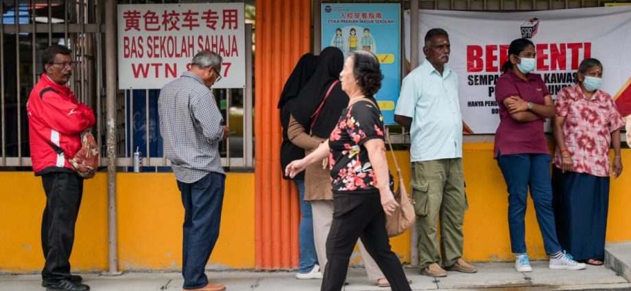 Hopes, frustration, and resolve on display as voting kicks off to a slow start in Malaysian state polls