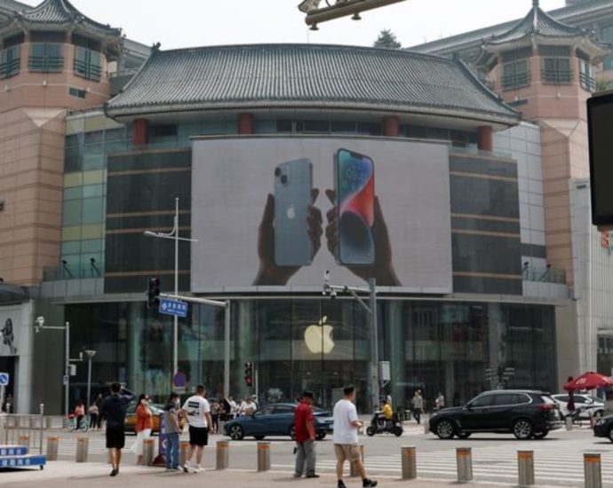 China moves to widen state employee iPhone curbs: Sources