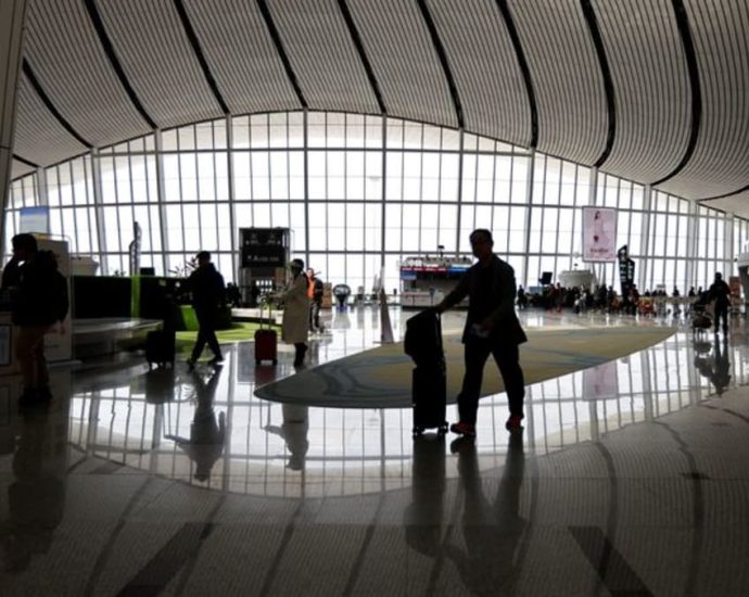 China tightens curbs on foreign travel by bankers, state workers