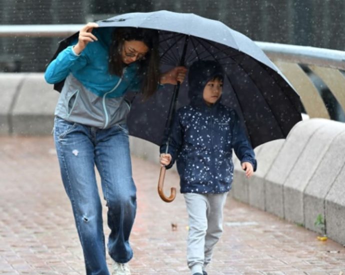 Hong Kong closes schools, raises warning for Typhoon Koinu