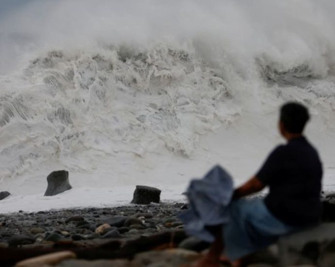 Millions off work as Typhoon Koinu brushes past Taiwan with lashing rain