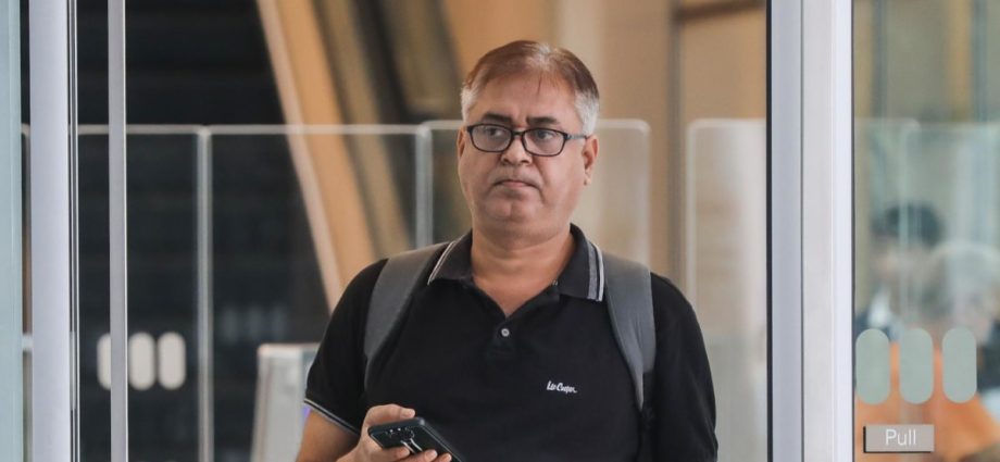 Retiree scammed of S$64,000 after computer was 'taken over', man who received the money on trial