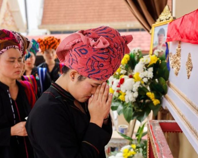 Thai mall shooting victim’s mother bids emotional farewell at cremation