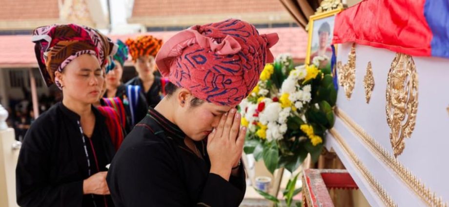 Thai mall shooting victim’s mother bids emotional farewell at cremation