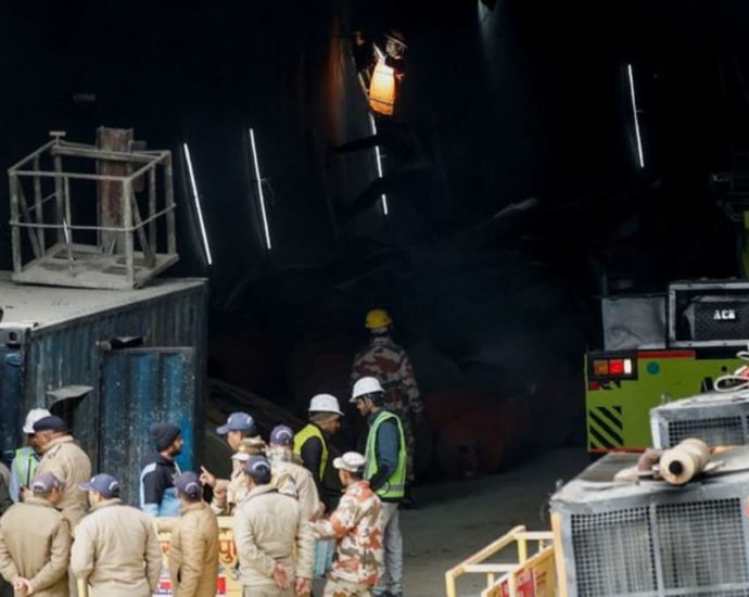 Indian rescuers break through debris to reach 41 men trapped in tunnel