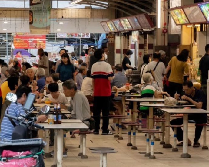 Why a national beach volleyball player and an engineer became 3rd-generation full-time hawkers