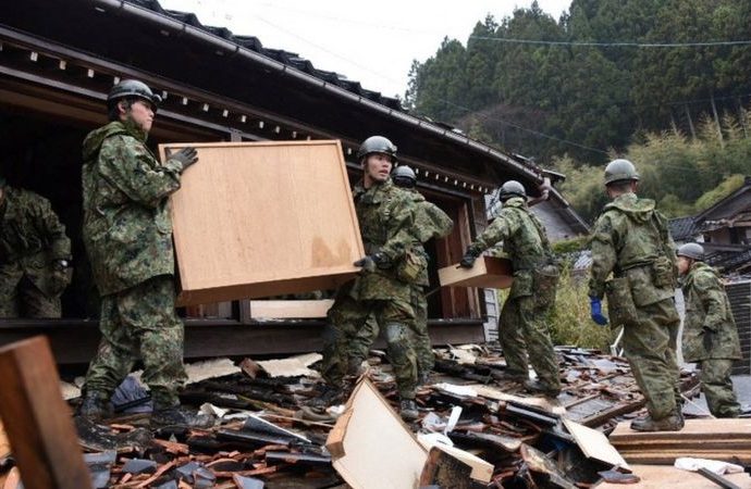 Japan earthquake: Woman in 90s found alive under rubble five days later