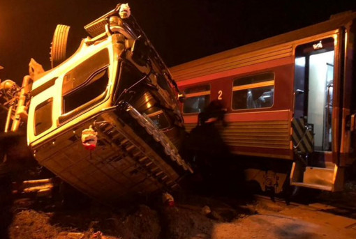 One killed, five hurt in train-truck crash
