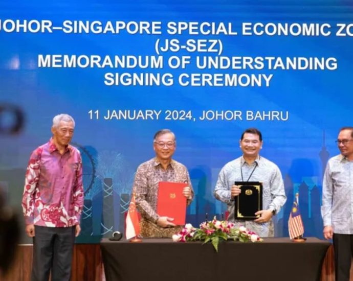 Singapore, Malaysia sign deal to set up special economic zone in Johor; passport-free access at land checkpoints being explored