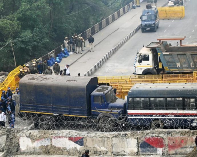 Indian police fire tear gas as protesting farmers march to capital