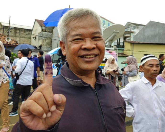 Indonesia Elections 2024: âFeast for democracyâ as voters turn out despite heavy rain to pick next president, legislators