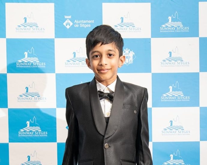 ‘Needs a booster cushion’: 8-year-old chess player who represents Singapore youngest to beat grandmaster