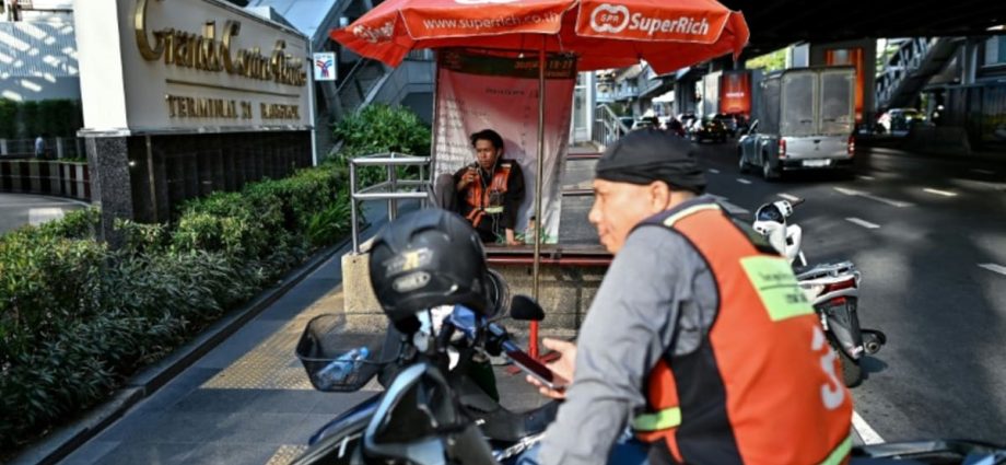 ‘Have to be outside’: Thai delivery riders swelter in heatwave