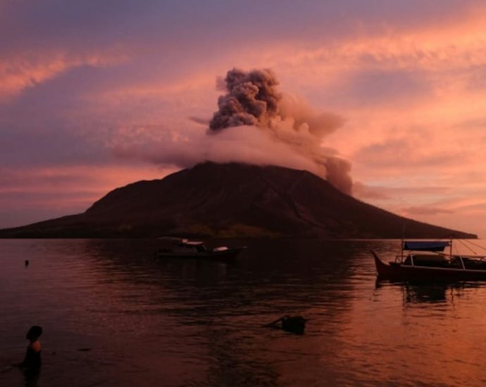 Indonesia lowers Mount Ruang volcano alert level, reopens nearby airport