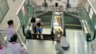 Woman hospitalised after falling through travelator in China