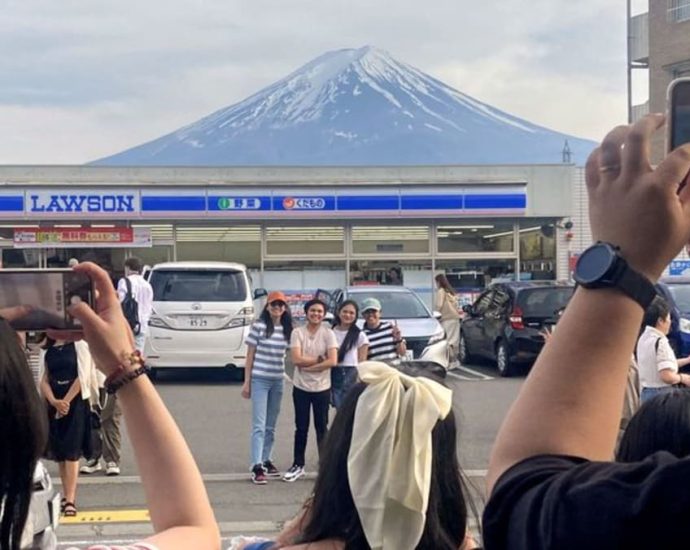 Japan town begins blocking Mount Fuji view from ‘bad-mannered’ tourists