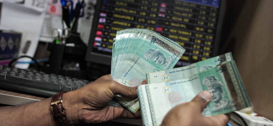 Malaysia’s currency woes spur financial stress, political discontent. Will the ringgit rise again?