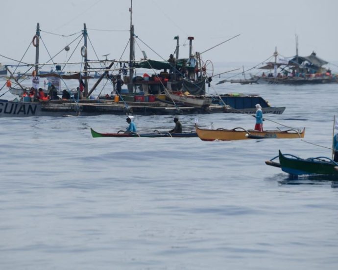 Philippine civilian convoy sails towards disputed reef
