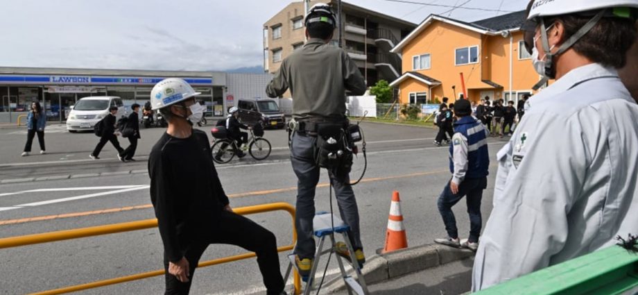 Sick of tourists, Japan town blocks view of Mount Fuji