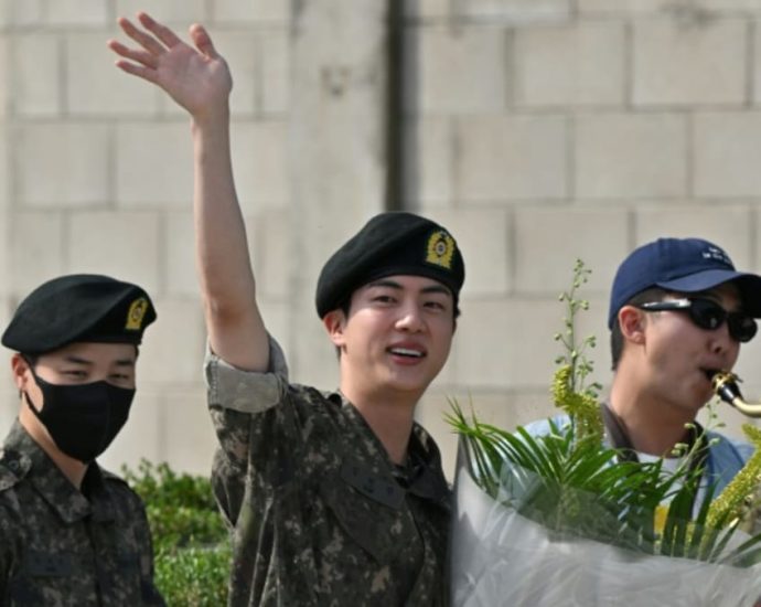 BTS star Jin finishes South Korean military service, greeted by bandmates