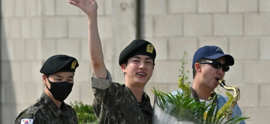 BTS star Jin finishes South Korean military service, greeted by bandmates