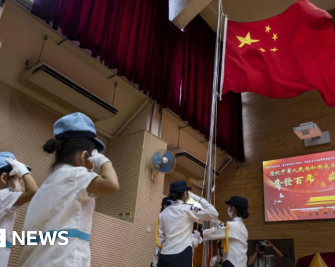 Hong Kong says school children sang anthem too softly