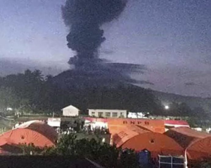 Indonesia’s Ibu volcano erupts twice, spewing red-hot lava