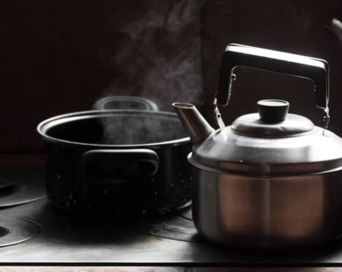 Mother admits splashing hot water on her 4 children