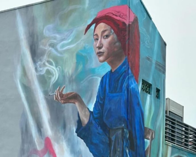 URA to re-evaluate stance over Chinatown mural featuring smoking samsui woman following public feedback