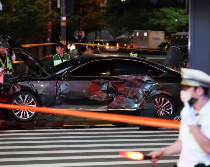 Car drives into crowd near Seoul city hall, nine dead