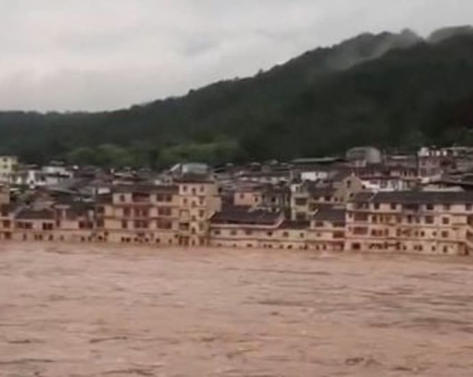 China bridge collapse kills 11 after torrential rains