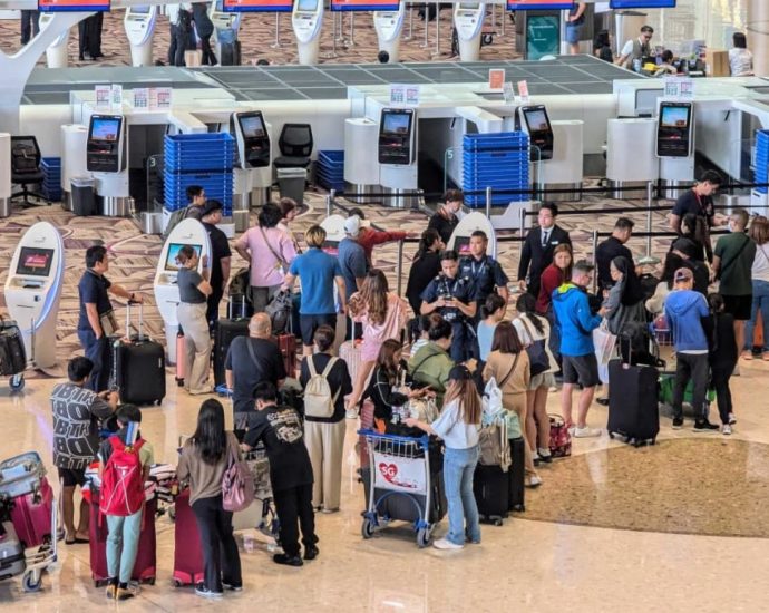Long queues, frustrated passengers at Changi Airport after some airlines’ systems go down in global IT glitch