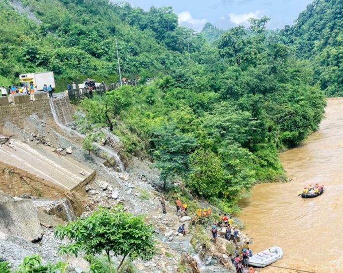 More than 60 missing after Nepal landslide sweeps two buses into river