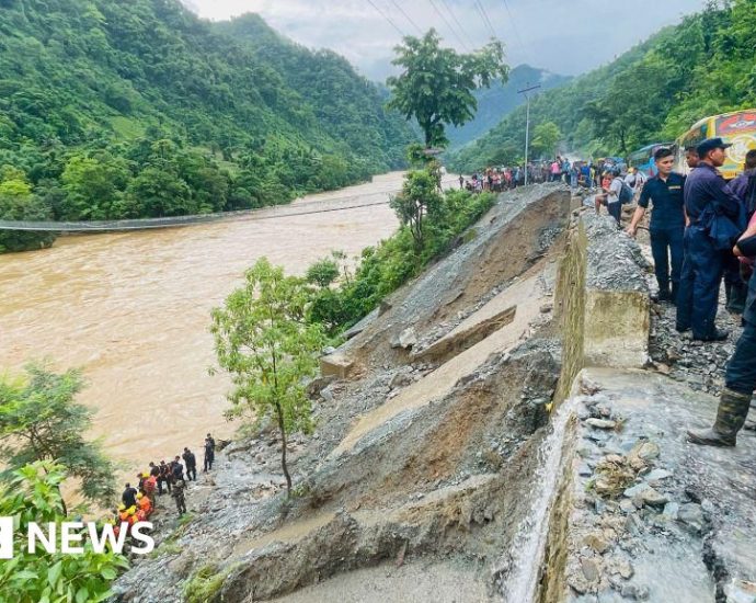 More than 60 missing as Nepal landslide sweeps buses into river